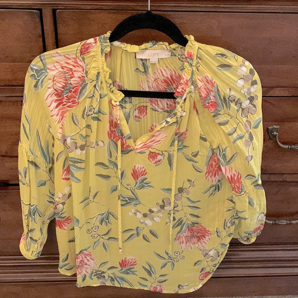 Yellow Georgette too with 3/4 sleeves and a ruffled neck with neck ties